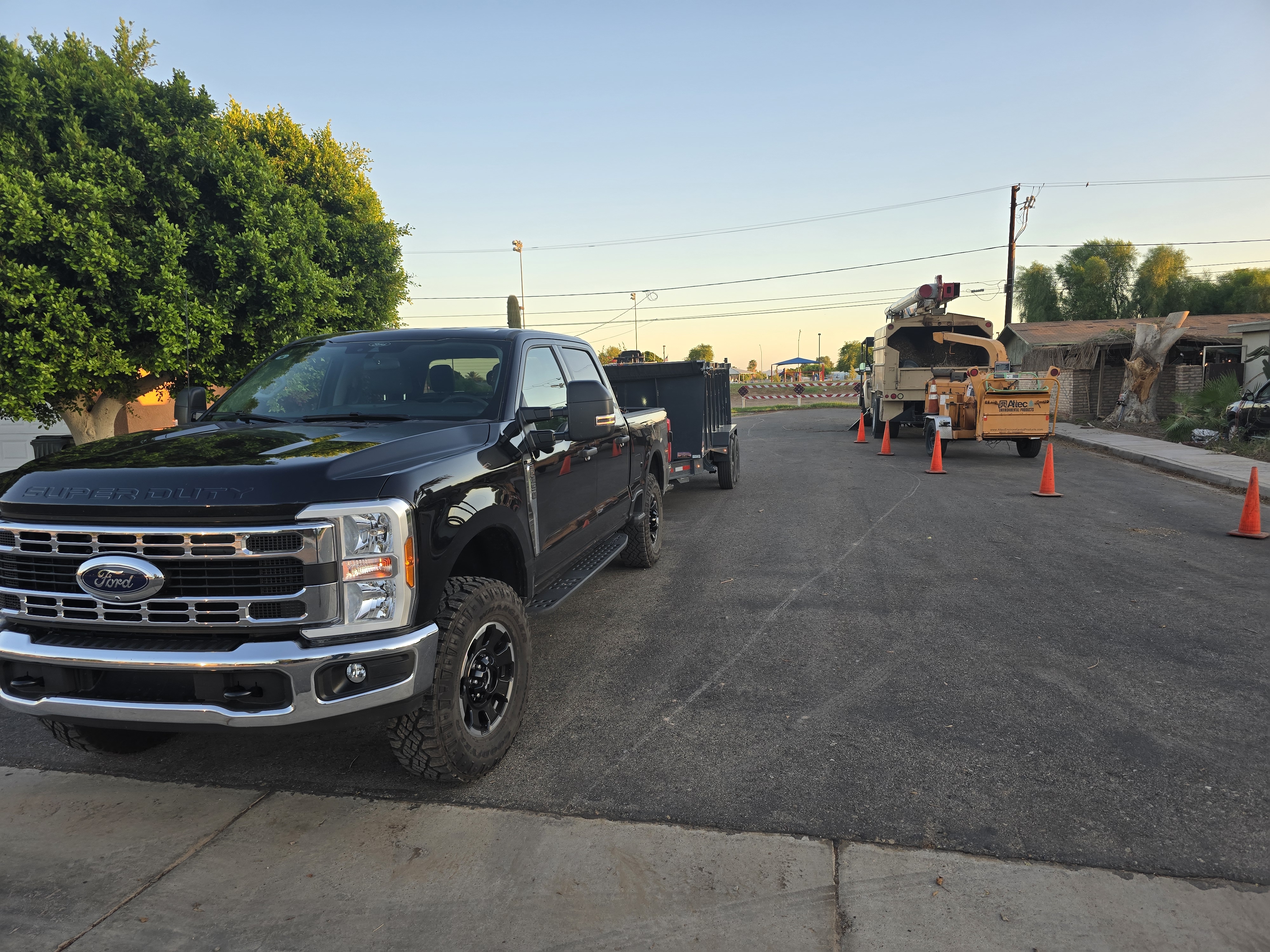NEXTLEVEL F350 and bucket truck staged on a Yuma tree care site