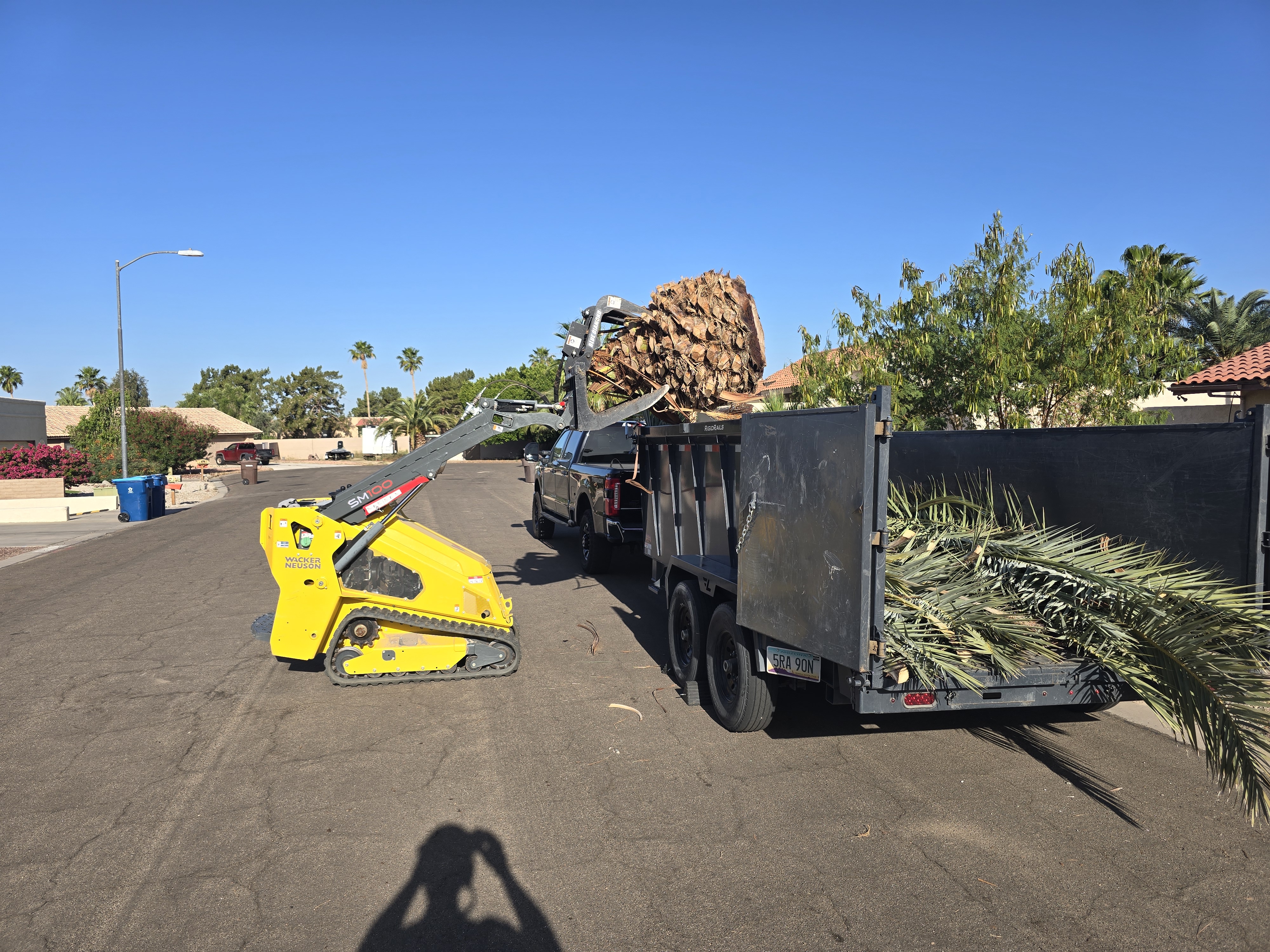 Compact loader used for debris handling and cleanup support